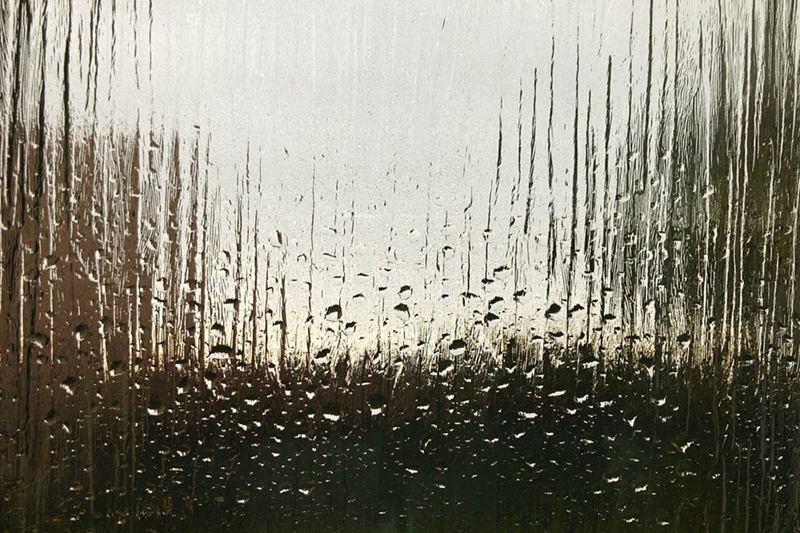 Condensation running down the inside of a window pane