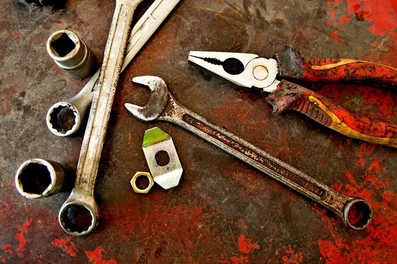 Rusty spanners and pliers ready for removing rust with home remedies