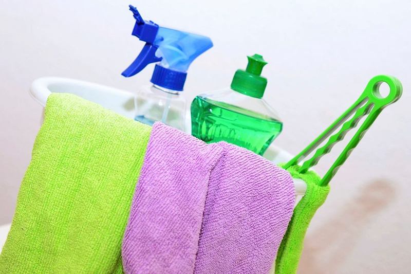 Bucket with microfibre cloths and cleaners for move-out cleaning