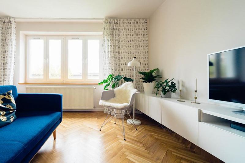 Bright living room with herringbone parquet, cleaned before moving in